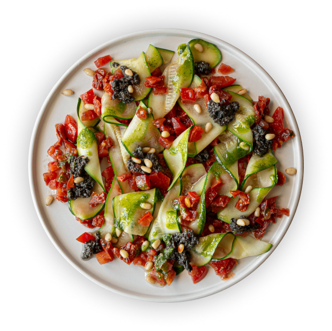 Una ensalada de Nora Real Food en plato